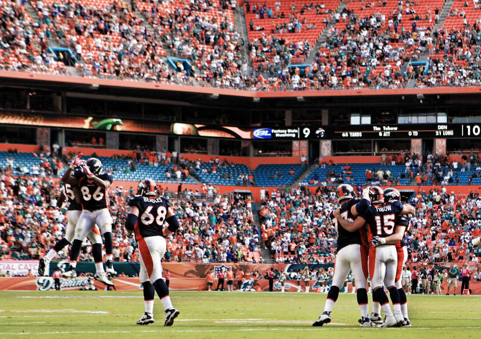 MIAMI GARDENS, FL - OCTOBER 23: Quarterback Tim Teebow #15 of the Denver Broncos celebrates a touchdown with tweamates after scoring against the Miami Dolphins at Sun Life Stadium on October 23, 2011 in Miami Gardens, Florida. Denver defeated Miami 18-15. (Photo by Marc Serota/Getty Images)