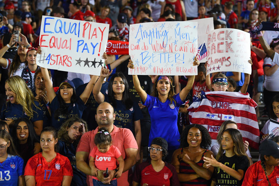 PASADENA, CA - AUGUST 03: Fans hold a women's rights and equal pay sign up during the USA Victory Tour match between the United States of America and the Republic of Ireland on August 3, 2019 at the Rose Bowl in Pasadena, CA (Photo by Brian Rothmuller/Icon Sportswire via Getty Images)