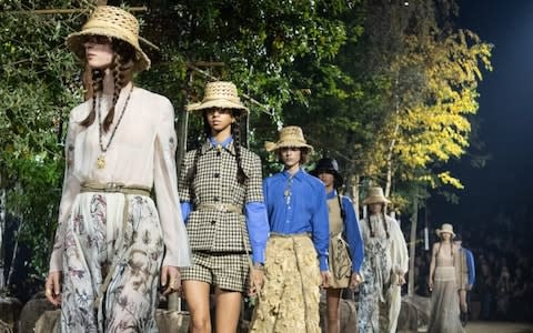 Heads together: Models at the finale of the Christian Dior Womenswear Spring/Summer 2020 show - Credit: Victor Boyko/Getty