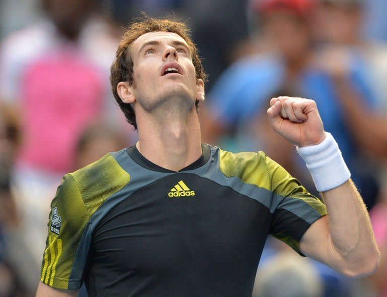 Britain's Andy Murray celebrates after victory in his men's singles match against France's Gilles Simon on the eighth day of the Australian Open tennis tournament in Melbourne on January 21, 2013. Roger Federer and Murray were locked on collision course at the Australian Open as an unstoppable Serena Williams powered towards her third straight Grand Slam title