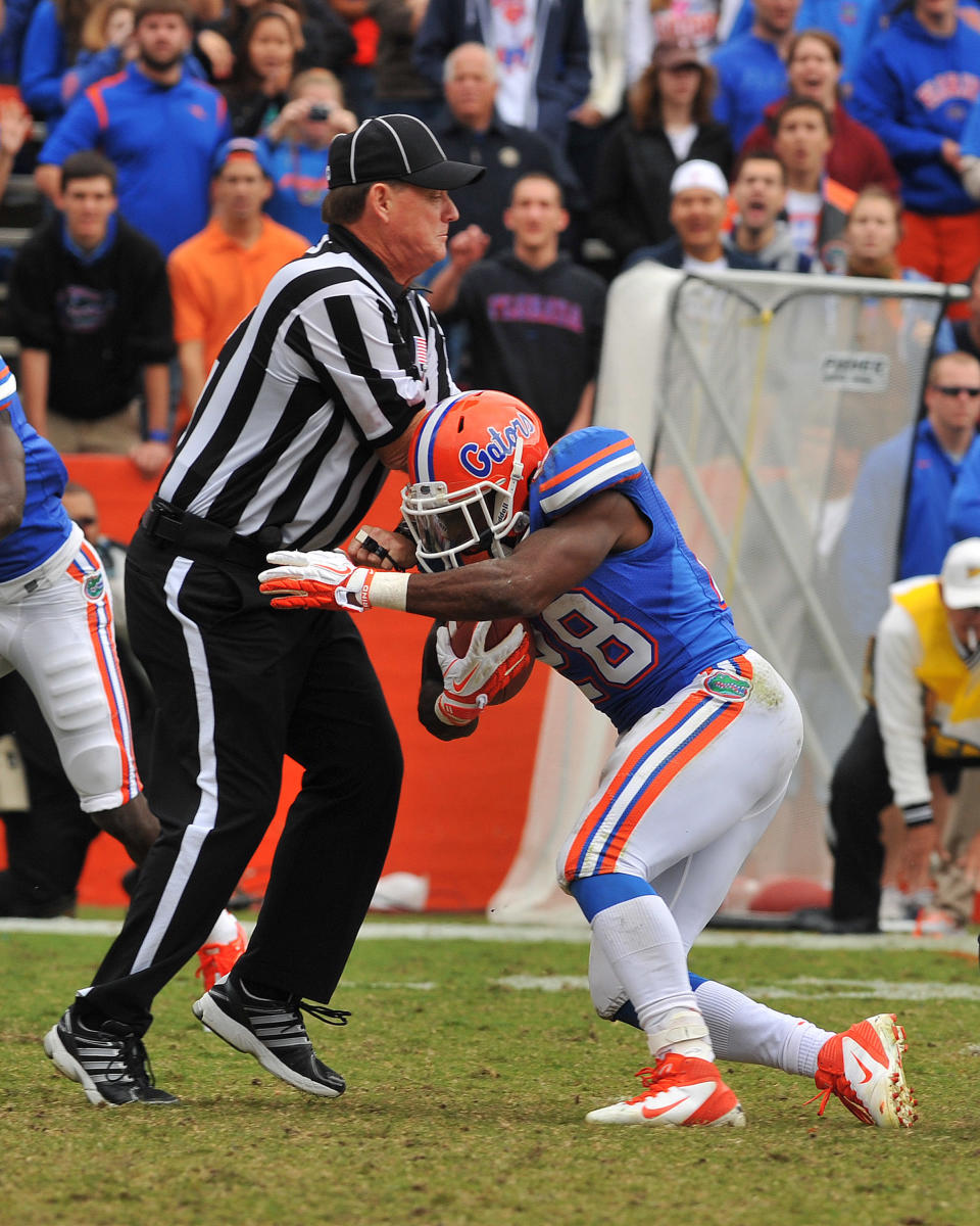 GAINESVILLE, FL - NOVEMBER 5: Running back Jeff Demps #28 of the Florida Gators runs into umpire Rick Lowe during play against the Vanderbilt Commodores November 5, 2011 at Ben Hill Griffin Stadium in Gainesville, Florida. Demps scored in the second quarter. (Photo by Al Messerschmidt/Getty Images)