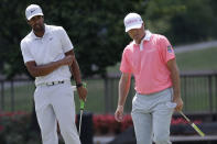 Tony Finau, left, reacts after missing a putt for birdie at the ninth hole next to Ryan Palmer during the third round of the Memorial golf tournament, Saturday, July 18, 2020, in Dublin, Ohio. (AP Photo/Darron Cummings)