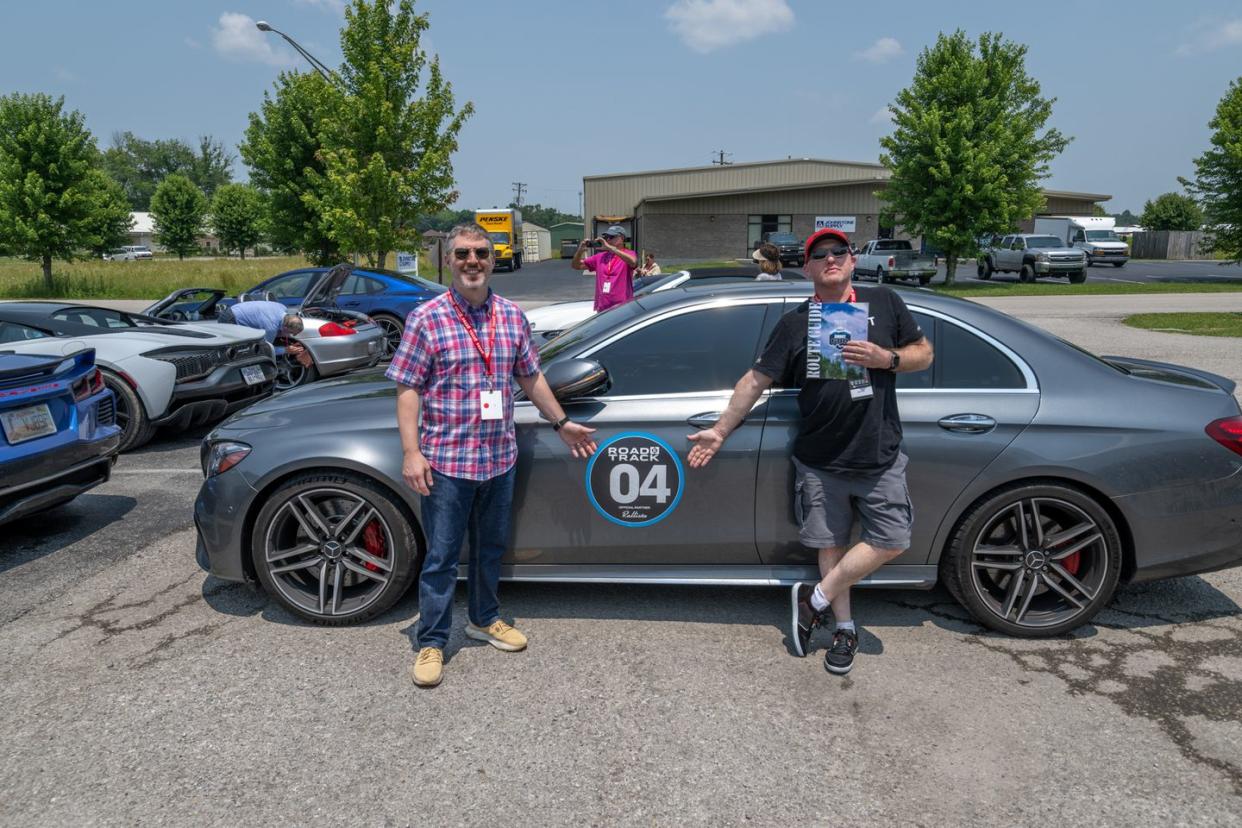 rally participants in front of vehicle