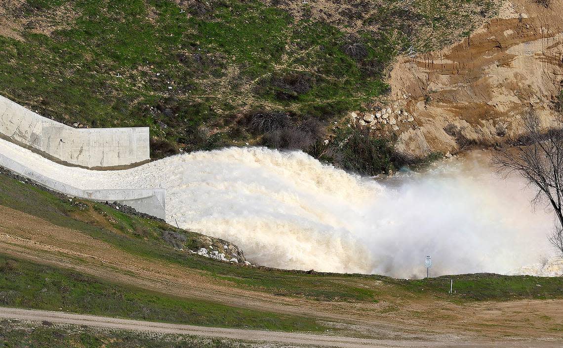 Water spills from Lake Nacimiento on Jan. 20, 2023, after the atmospheric river storms dumped billions of gallons of water into the reservoir.