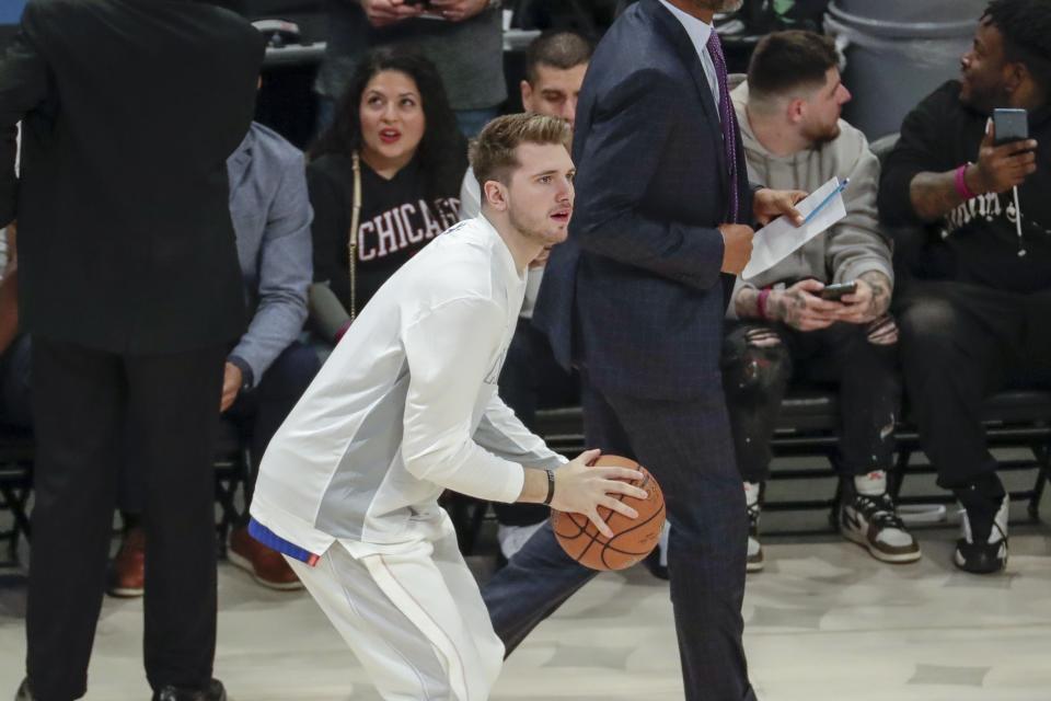 Luka Doncic of the Dallas Mavericks warms up before the NBA All-Star basketball game Sunday, Feb. 16, 2020, in Chicago. (AP Photo/David Banks)