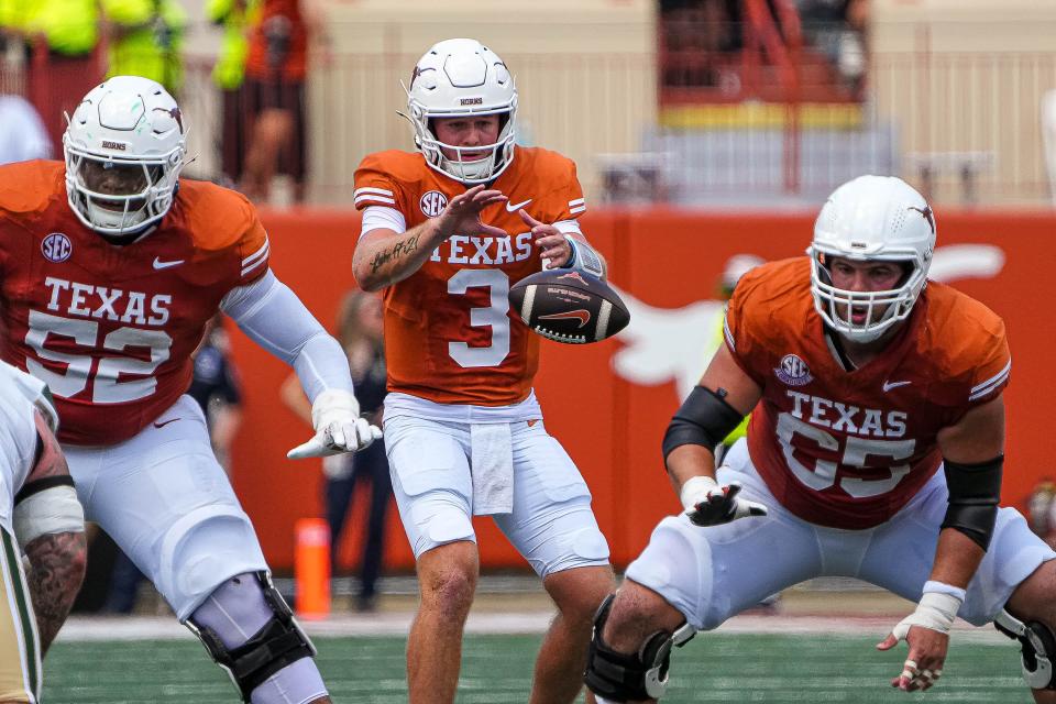 Quarterback Quinn Ewers, taking a snap from center Jake Majors, threw three touchdown passes to transfer receivers — two to Matthew Golden (Houston) and one to Isaiah Bond (Alabama) — as Texas opened the season with a 52-0 win over Colorado State on Saturday at Royal-Memorial Stadium.