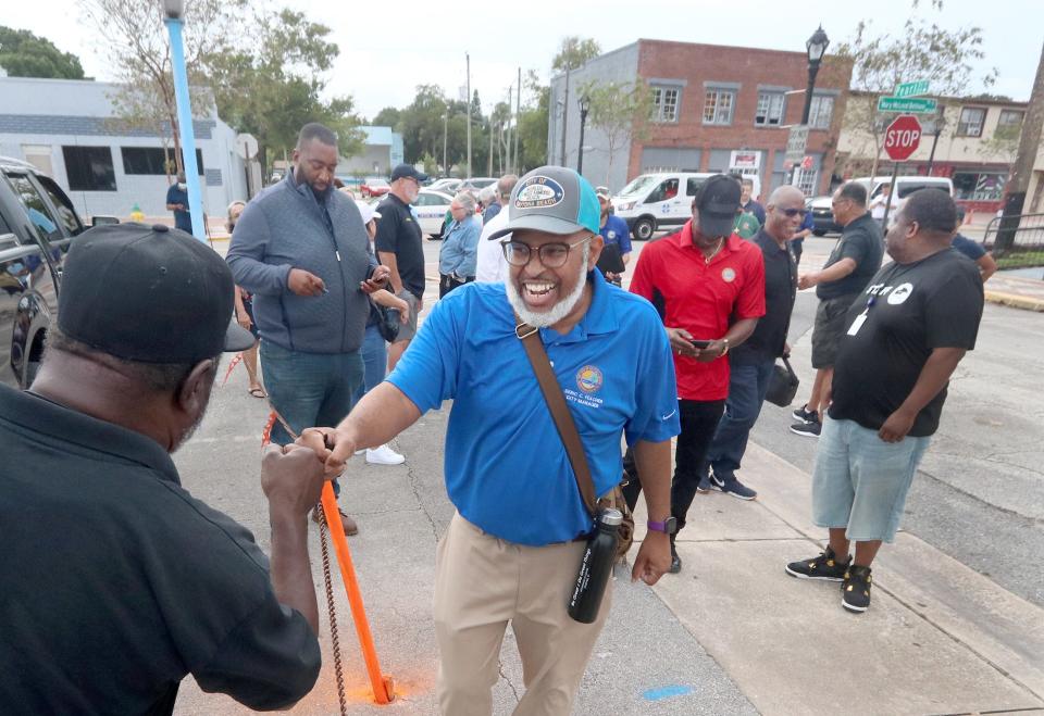 Daytona Beach's Midtown neighborhood has been in need of revitalization for decades. Daytona Beach City Manager Deric Feacher is shown walking along Mary McLeod Bethune Boulevard in 2021 as he fist bumped Pride Tire Services owner Johnny Pride. Feacher was leading a group of city staff members, residents and business owners as part of an effort to see what the neighborhood needs.