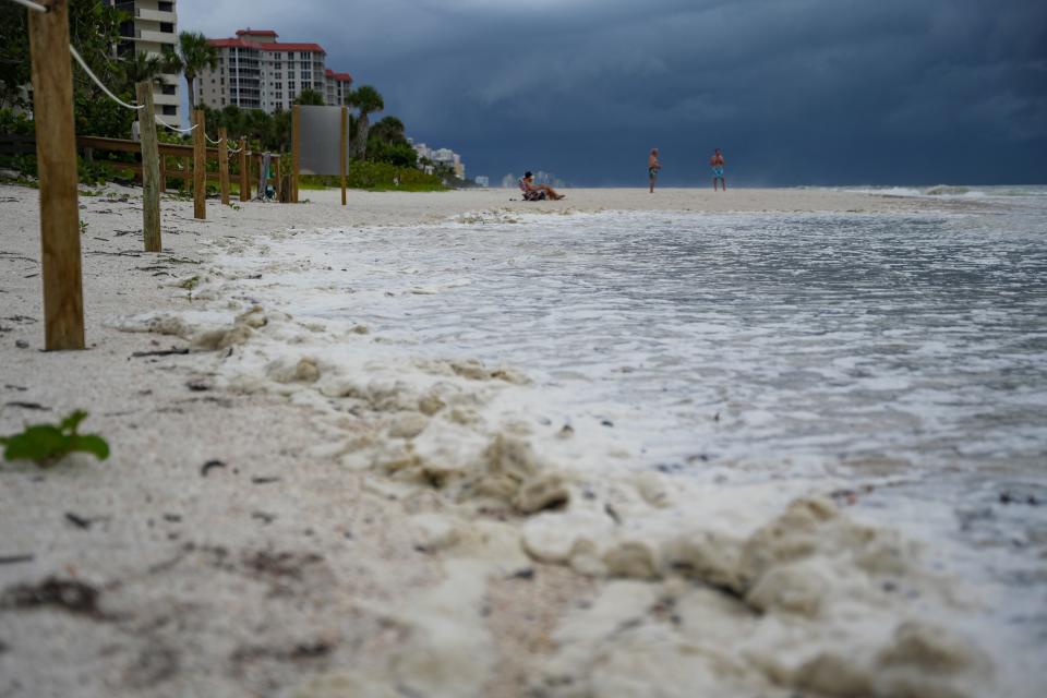 A wave reaches wooden stakes near the entrance at Delnor-Wiggins Pass State Park as Hurricane Idalia passes Naples during a king tide on Tuesday, Aug. 29, 2023.