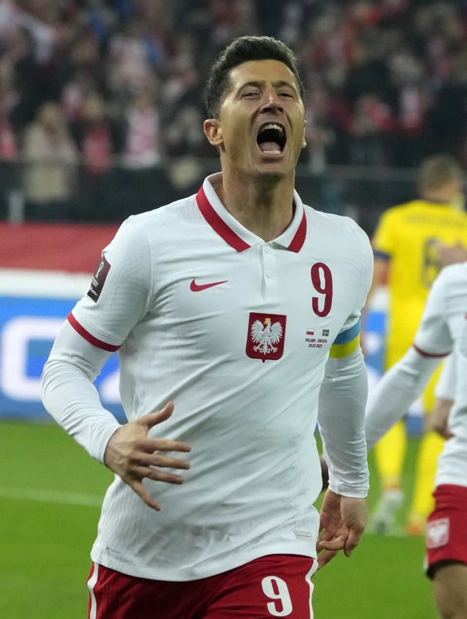Poland's Robert Lewandowski celebrates after scoring the opening goal of his team during the World Cup 2022 playoff soccer match between Poland and Sweden at Silesian Stadium, in Chorzow, southern Poland, Tuesday, March 29, 2022. (AP Photo/Czarek Sokolowski)
