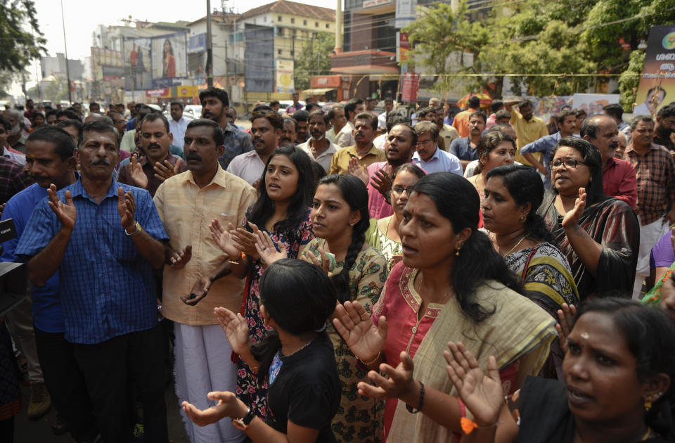 Hindus chant devotional songs during a protest against reports of two women of menstruating age entering the Sabarimala temple, one of the world's largest Hindu pilgrimage sites, in Thiruvananthapuram, Kerala, India, Wednesday, Jan. 2, 2019. India's Supreme Court on Sept. 28, 2018 lifted the ban on women of menstruating age from entering the temple, holding that equality is supreme irrespective of age and gender. (AP Photo/R S Iyer)