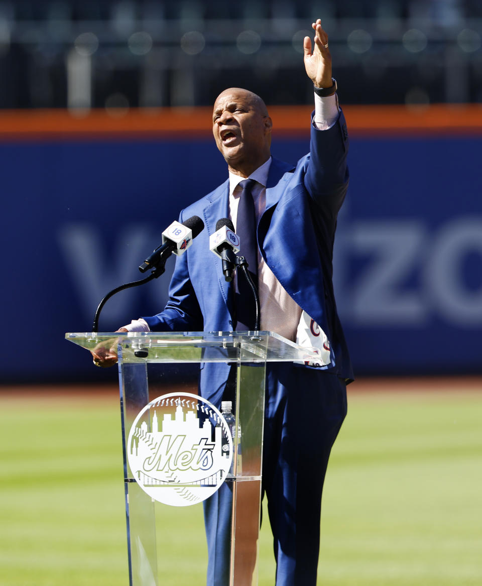 Former New York Mets outfielder Darryl Strawberry acknowledges fans during ceremony to retire his number at Citi Field, Saturday, June 1, 2024, in New York. (AP Photo/Noah K. Murray)