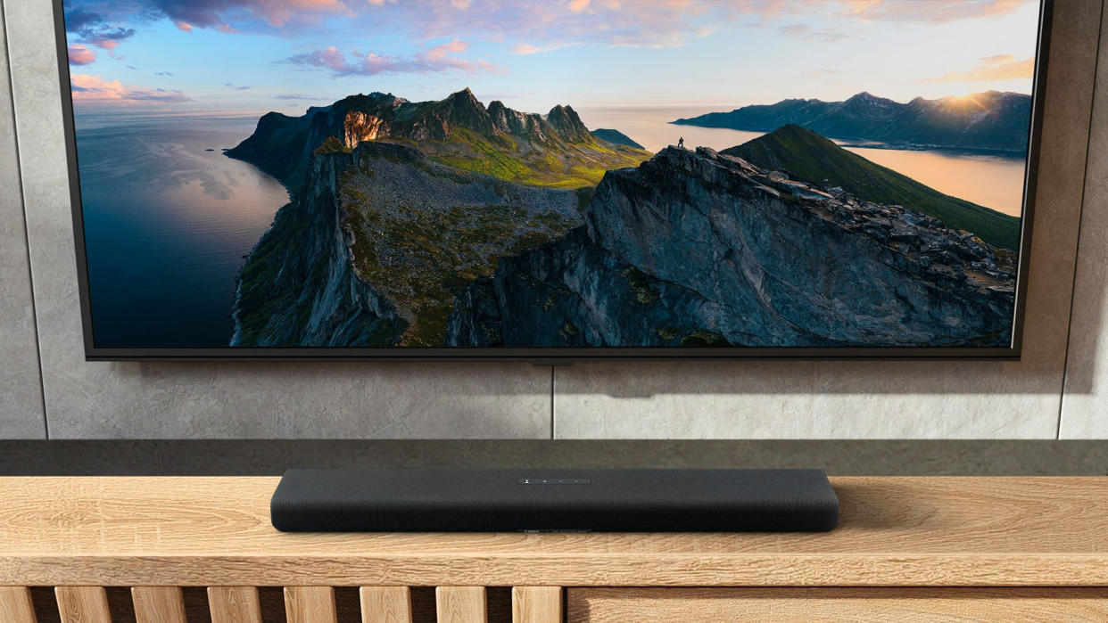  Yamaha Dolby Atmos soundbar on wooden unit 