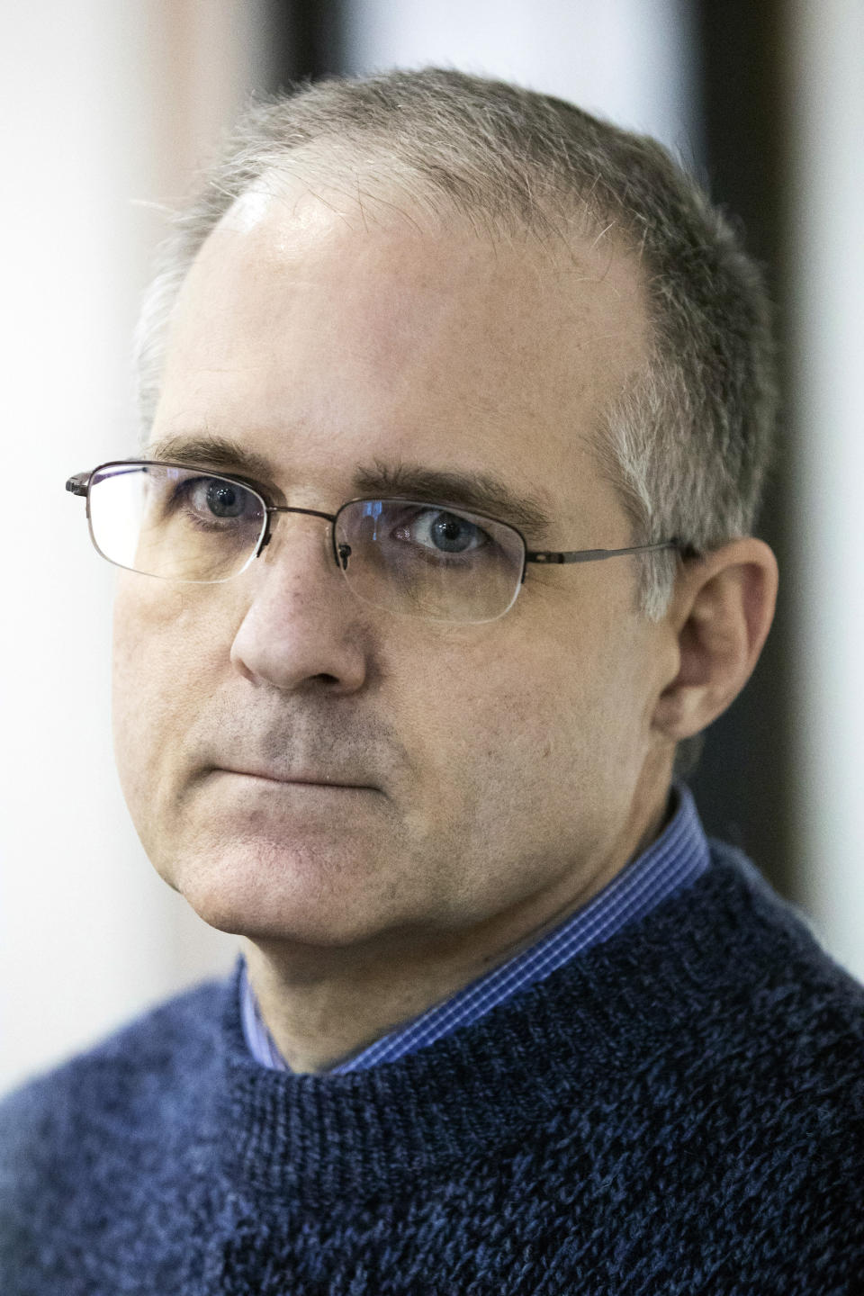 Paul Whelan, a former U.S. Marine, who was arrested in Moscow at the end of last year, waits for a hearing in a court in Moscow, Russia, Friday, May 24, 2019. The American was detained at the end of December for alleged spying. (AP Photo/Pavel Golovkin)