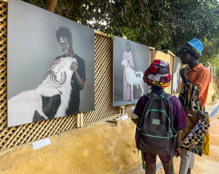 People visit photo exhibition named as &quot;Sama Ladoum (My Ladoum)&quot; by French photojournalist Sylvain Cherkaoui with the theme Ladoum, known as the &quot;king of sheep&quot; in Senegal and West Africa, and its breeders, as part of OFF, the side event of the 14th Dakar Biennial in Dakar, Senegal on June 1, 2022.