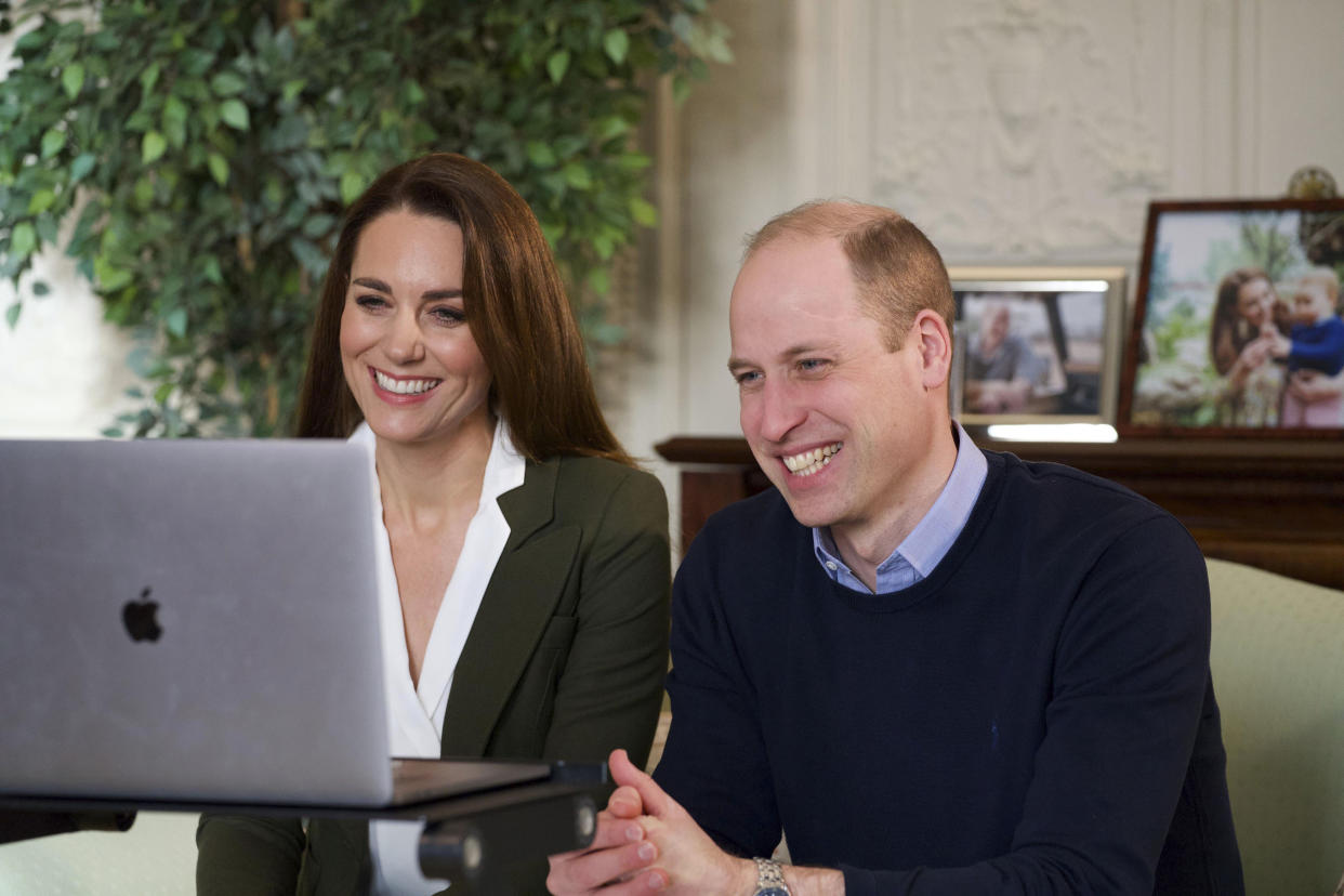 <p>Prince William and Kate, Duchess of Cambridge smile during a video call to people with health conditions about the positive impact of the COVID-19 vaccine. </p> (AP)