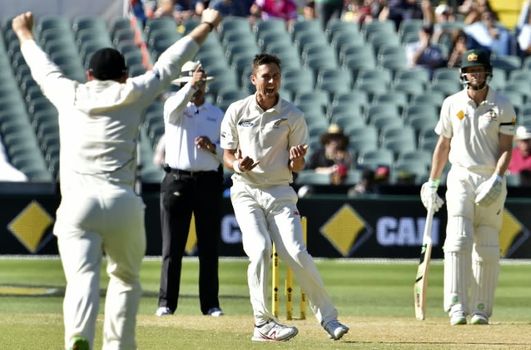 New Zealand's paceman Trent Boult (C) celebrates his wicket of Australia's batsman Steve Smith during the third day of the day-night cricket Test match at the Adelaide Oval on November 29, 2015