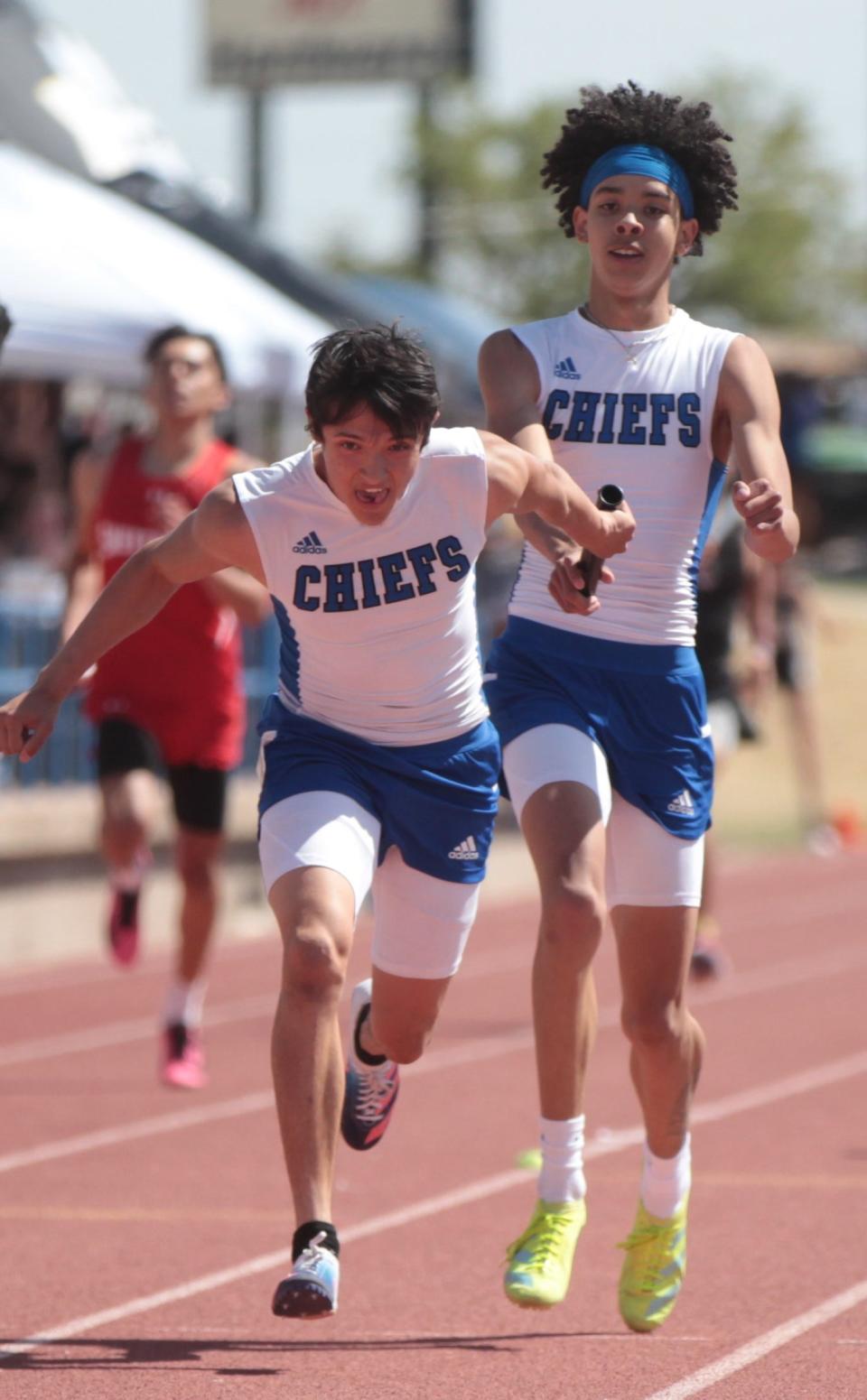 San Angelo Lake View's Devyn Paz, right, passes the baton to teammate Brandon Cruz in the boys 4x200-meter relay at the District 3-4A Track and Field Meet Thursday, April 14, 2022, at San Angelo Stadium.