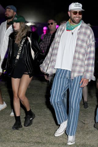<p>Gilbert Flores/WWD via Getty</p> Taylor Swift and Travis Kelce at Neon Carnival held during the Coachella Music and Arts Festival on April 13, 2024 in Thermal, California.