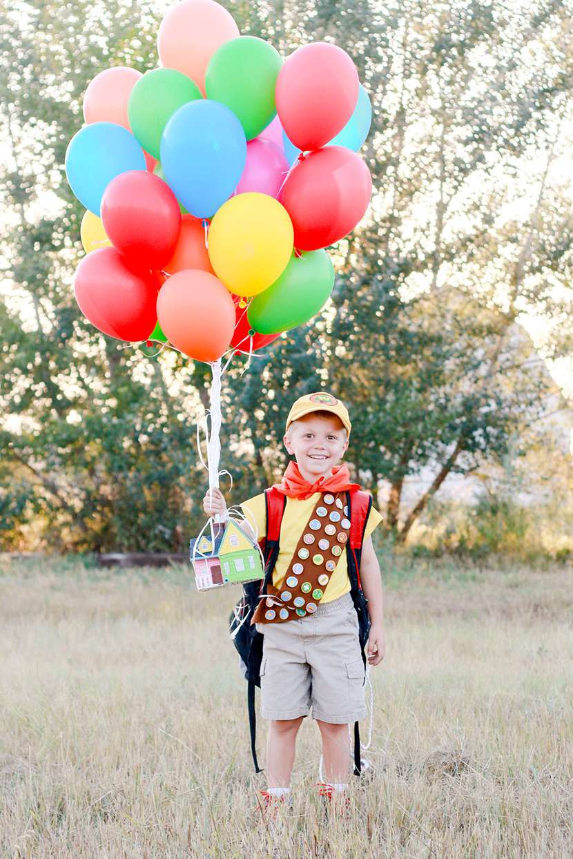 young boy dressed as character form Up