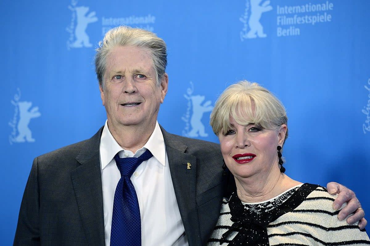 Beach Boys star Brian Wilson (left) has announced the death of his wife Melinda Ledbetter (right) (AFP via Getty Images)