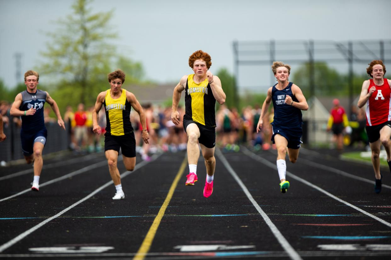 Hamilton's Ben Boehm sprints down the lane in the boy's 100 Friday, May 12, 2023, at Unity Christian High School.