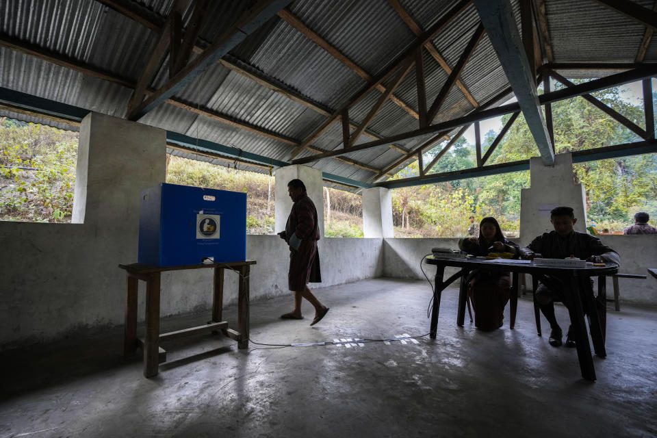 A Bhutanese villager heads to cast his vote at a polling centre during in Martang village, Bhutan, Tuesday, Jan. 9, 2024. Voters in Bhutan, a landlocked country in the eastern Himalayan mountain range with a population of around 800,000 people, are casting ballots to elect a new Parliament. (AP Photo/Anupam Nath)