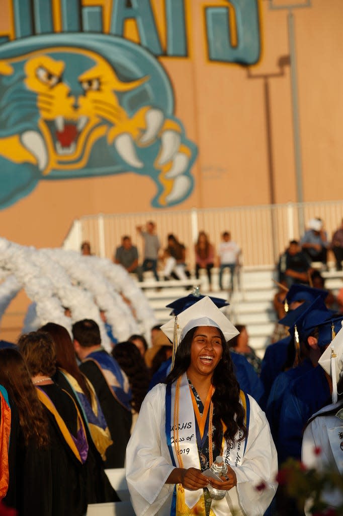 A graduate of West Shores High School smiles during commencement ceremonies on June 5, 2019 in Salton City. 