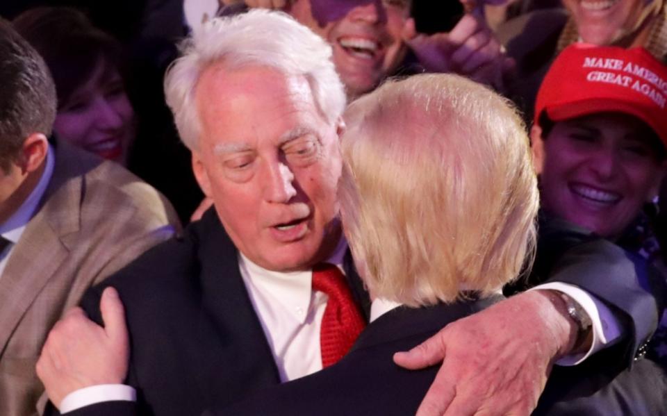 Republican president-elect Donald Trump hugs his brother Robert Trump after delivering his acceptance speech - Getty