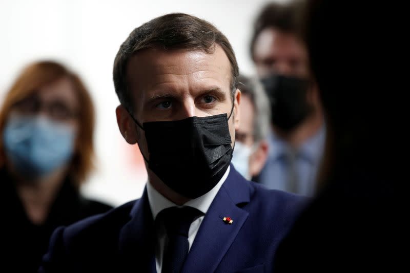 FILE PHOTO: French President Macron visits a coronavirus disease (COVID-19) vaccination center in Bobigny