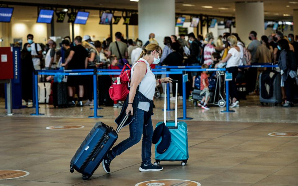 Chaos and long queues built up at Faro Airport as they interrupt their holidays in the Algarve to return home before quarantine kicks in - LUIS FORRA/EPA-EFE/Shutterstock