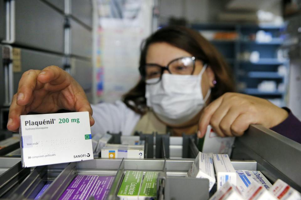 <span class="caption">A box of hydroxychloroquine, marketed under the name of Plaquenil, in a Paris pharmacy.</span> <span class="attribution"><a class="link " href="https://www.gettyimages.com/detail/news-photo/pharmacy-employee-wearing-a-protective-mask-shows-a-box-of-news-photo/1215113294?adppopup=true" rel="nofollow noopener" target="_blank" data-ylk="slk:Getty Images / Chesnot;elm:context_link;itc:0;sec:content-canvas">Getty Images / Chesnot</a></span>