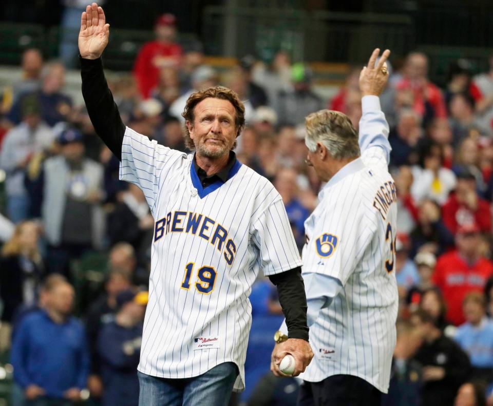 Robin Yount (left) and Rollie Fingers wave to fans before the ceremonial first pitch at opening day as the Milwaukee Brewers take on the. St. Louis Cardinals in 2019 on opening day.