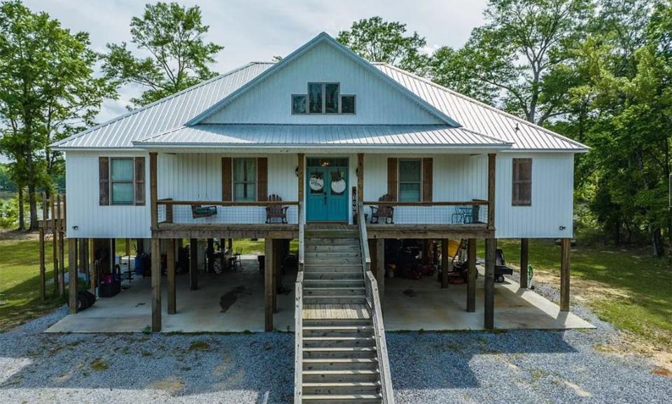 The home at 2093 Robinson Pond Road in Grandview Harbor includes four bedrooms and three and a half bathrooms within 3,162 square feet of living space. The property is located on the banks of the Alabama River and is for sale for $599,000.