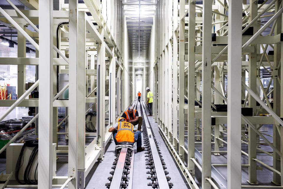 Construction workers install equipment at Ultium Cells in Spring Hill, Tenn. on Thursday, Aug. 3, 2023.