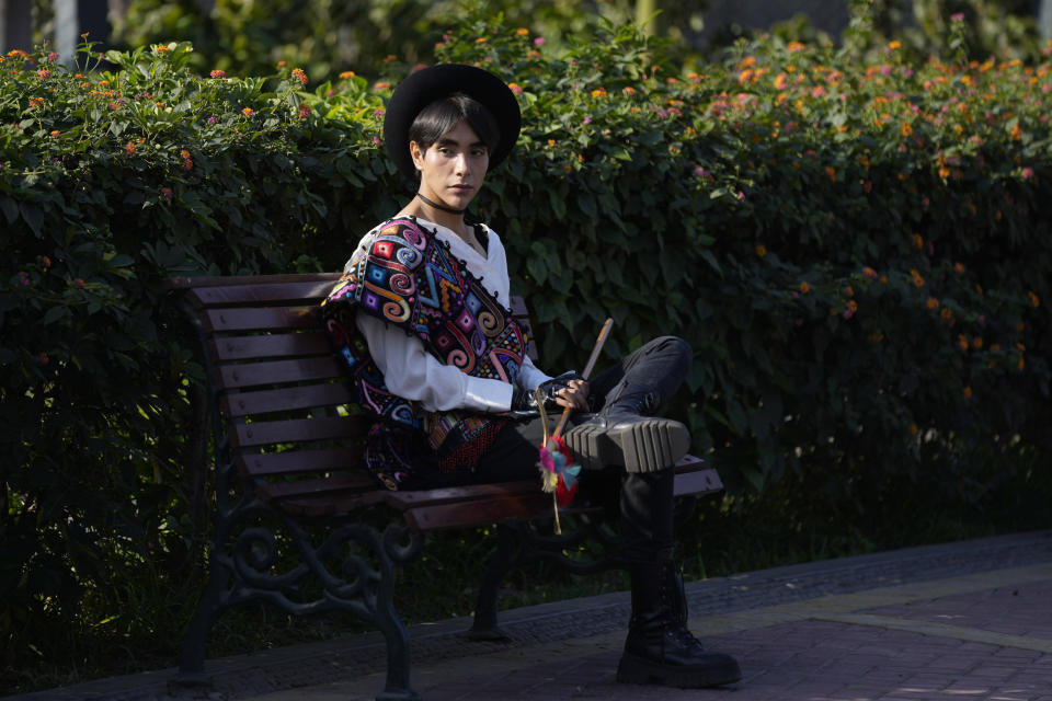 Peruvian singer Lenin Tamayo takes a break while recording a music video in downtown Lima, Peru, Thursday, Aug. 3, 2023. With his fusion of K-pop and Andean culture, the 23-year-old composer is known as the inventor of Quechua pop or Q-pop, writing songs in Spanish and Quechua. (AP Photo/Martin Mejia)