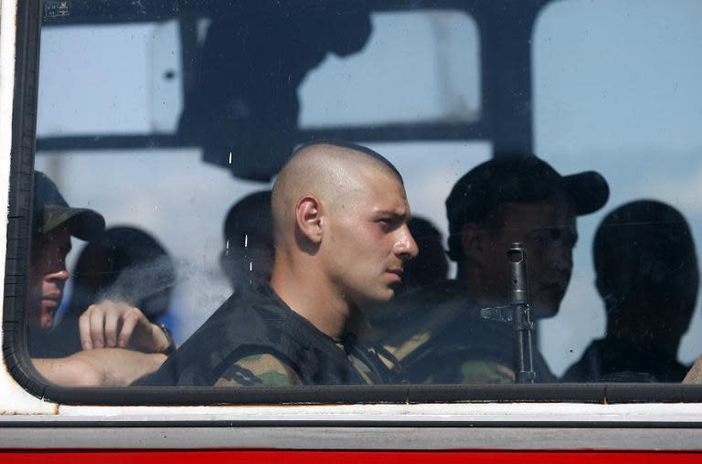 A Ukrainian servicemen sits in a bus near the eastern Ukrainian city of Slavyansk, in the region of Donetsk, on August 5, 2014