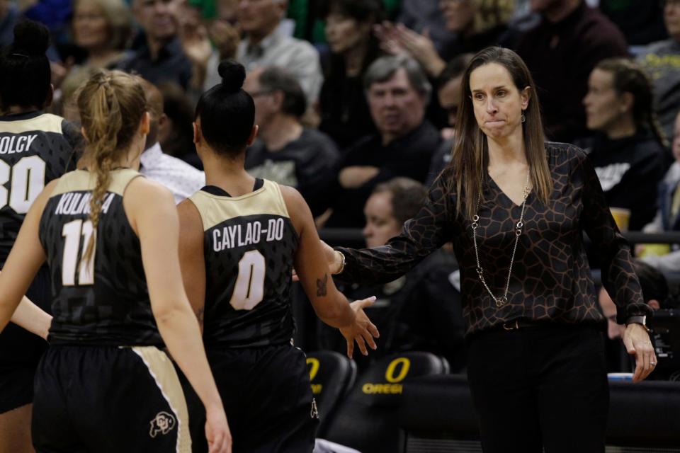 Colorado coach JR Payne, right, calls her team to the bench for a timeout during the fourth quarter of an NCAA college basketball game against Oregon in Eugene, Ore., Friday, Jan. 3, 2020. (AP Photo/Chris Pietsch)