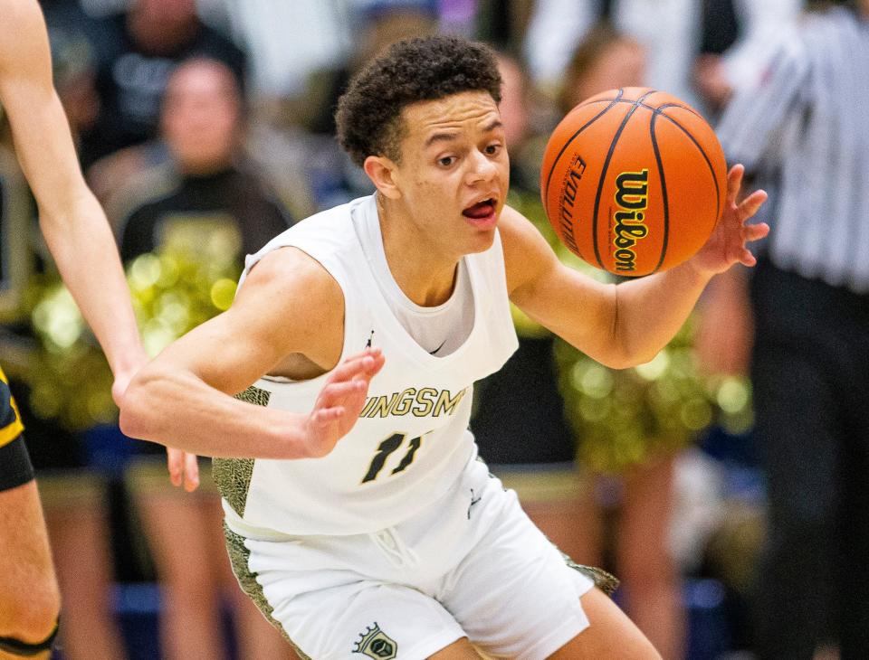 Penn's Joe Smith (11) grabs a loose ball during the Penn vs. Chesterton boys regional championship basketball game Saturday, March 12, 2022 at Michigan City High School. 