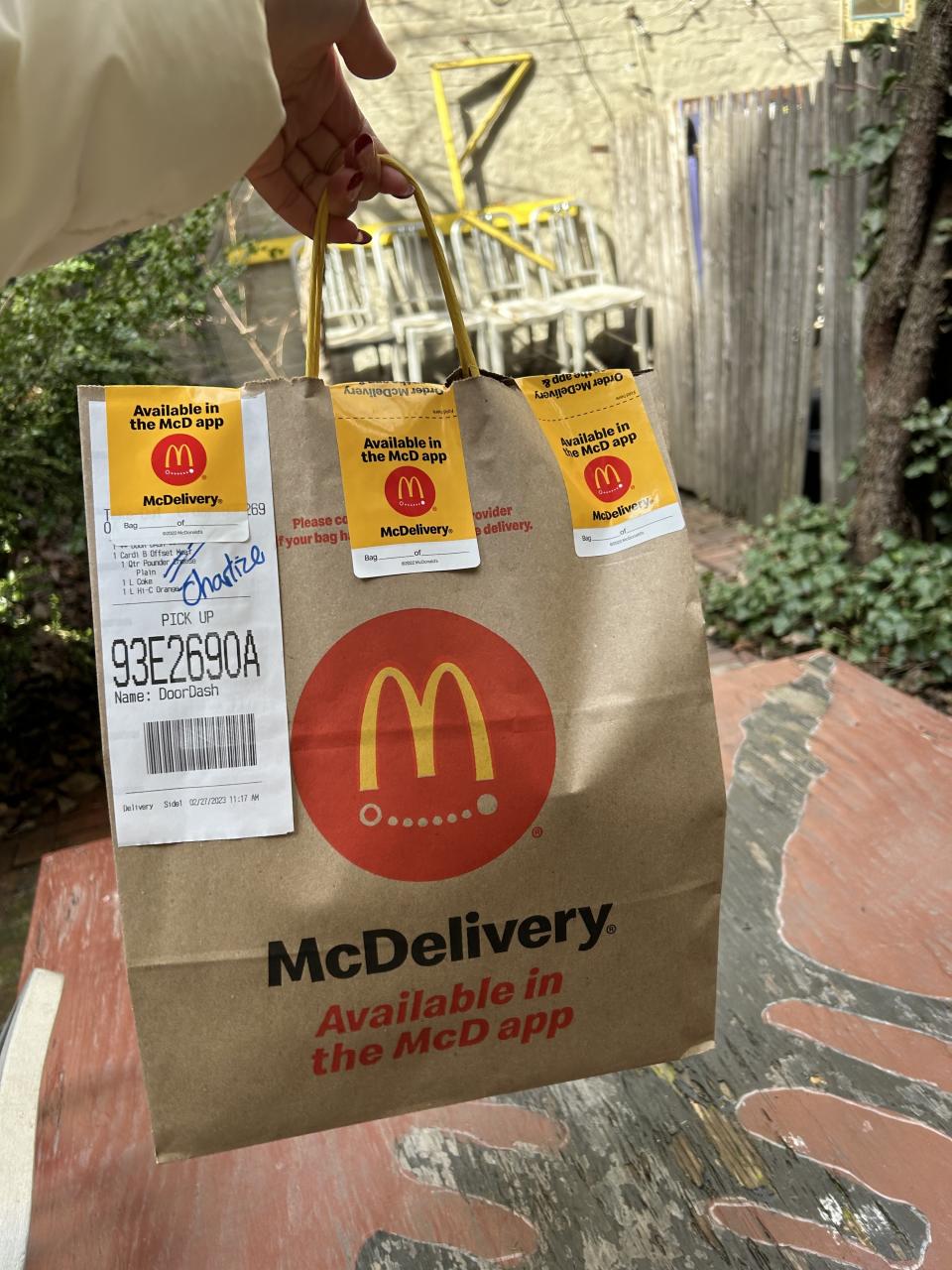 Jen holding up the McDonalds bag