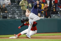 Cleveland Guardians' Jose Ramirez slides safely into third base with a one-run triple as Tampa Bay Rays third baseman Isaac Paredes waits for the throw during the third inning of a baseball game, Tuesday, Sept. 27, 2022, in Cleveland. (AP Photo/Ron Schwane)