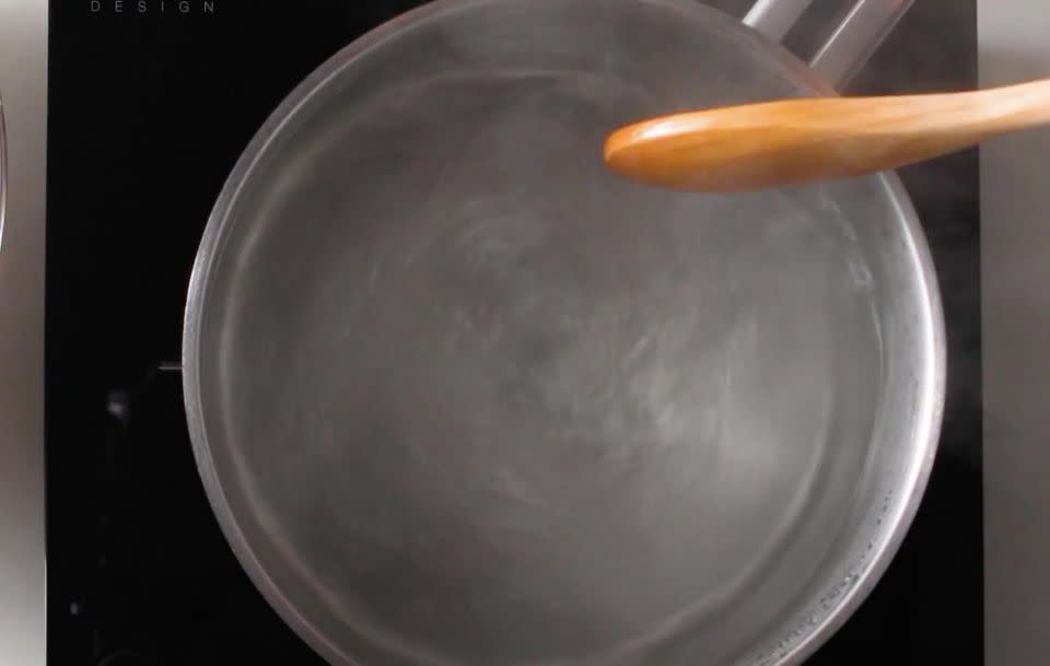 This is where it gets interesting. You need to then make a whirlpool with boiling water in a saucepan. Source: Food52 / Vimeo