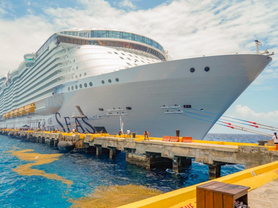 wonder of the seas ship docked on a cloudy day