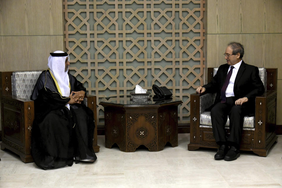 Syrian Foreign Minister Faisal Mekdad, right, meets with the new United Arab Emirates Ambassador to Syria Hassan Ahmad al-Shihi and receive his credentials, in Damascus, Syria, Tuesday, January. 30, 2024. The first United Arab Emirates ambassador to Damascus in nearly 13 years took up his post on Tuesday as Syria has been reintegrating into mainstream regional acceptance. (SANA via AP)