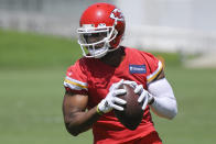 Kansas City Chiefs wide receiver JuJu Smith-Schuster makes a catch during the NFL football team's mandatory minicamp Tuesday, June 14, 2022, in Kansas City, Mo. (AP Photo/Reed Hoffmann)