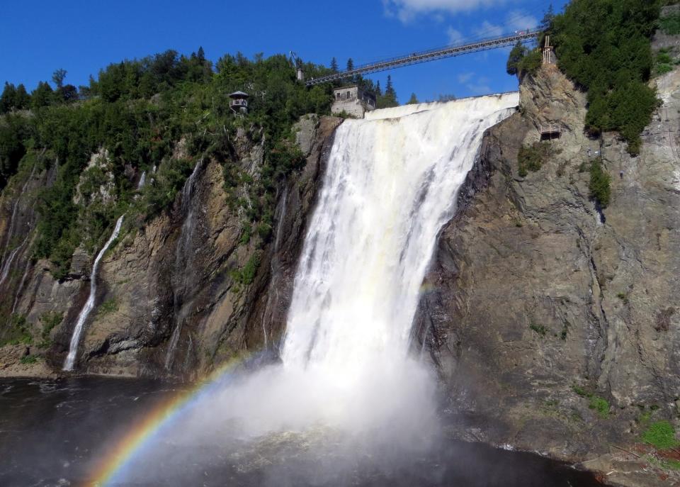 This Aug. 13, 2013 provided by R.M. Green shows Montmorency Falls outside Quebec City. Quebec City is the starting point for many cyclists traveling east along the St. Lawrence River through quiet villages overlooking sweeping river vistas. (AP Photo/R. M. Green)