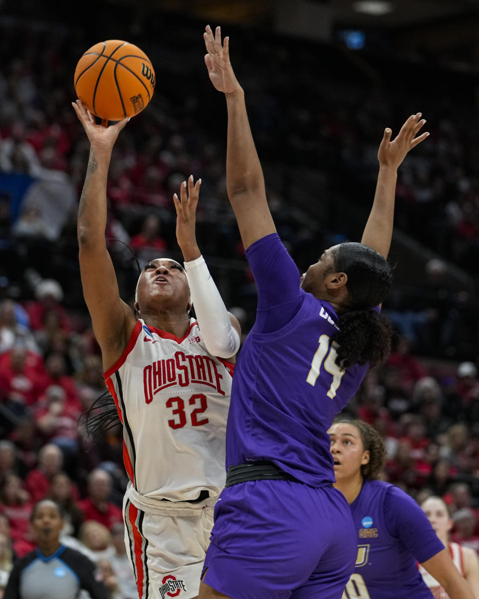Ohio State forward Cotie McMahon (32) shoots over James Madison forward Annalicia Goodman (14) in the second half of a first-round college basketball game in the women's NCAA Tournament in Columbus, Ohio, Saturday, March 18, 2023. Ohio State defeated James Madison 80-66. (AP Photo/Michael Conroy)