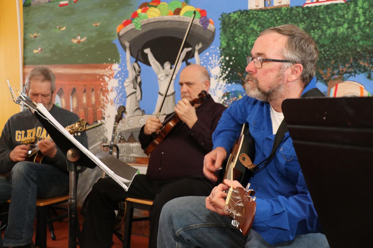 Eliot Gitelman and Mike Collins, members of local Irish band Si Bheag Si Mohr play traditional Irish music Friday at El Taco Loco Mexican Taqueria. Sturgis downtown businesses celebrated the winding down of winter Friday, March 24, 2023, with the annual "Winter Wine Down" event.