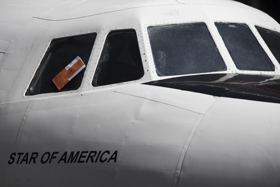 A parking ticket is placed on the cockpit window of a Lockheed Constellation L-1649A Starliner, known as the "Connie, is parked in New York's Times Square during a promotional event, Saturday, March 23, 2019, in New York. The vintage commercial airplane will serve as the cocktail lounge outside the TWA Hotel at JFK airport, a hotel that promises to bring back "the magic of the Jet Age." (AP Photo/Mary Altaffer)