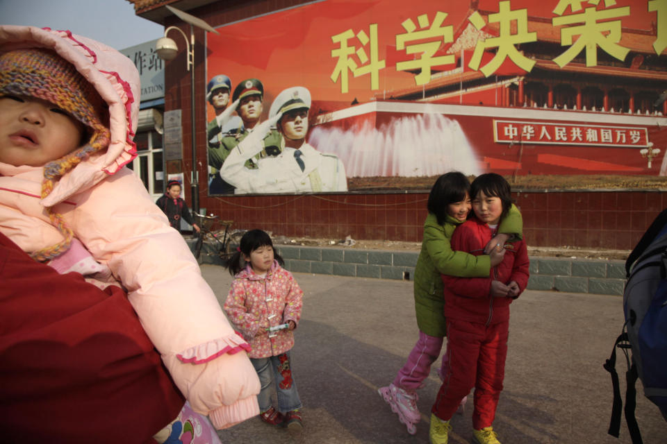 FILE - In this Wednesday, Feb. 3, 2010 file photo, children play at a square in Beijing. Five years after the deepest global recession since the 1930s sent birth rates plunging around the world, many couples are still not having children. That’s good news if you’re worried about an overcrowded planet. But it’s bad for the economy. (AP Photo/Ng Han Guan, File)