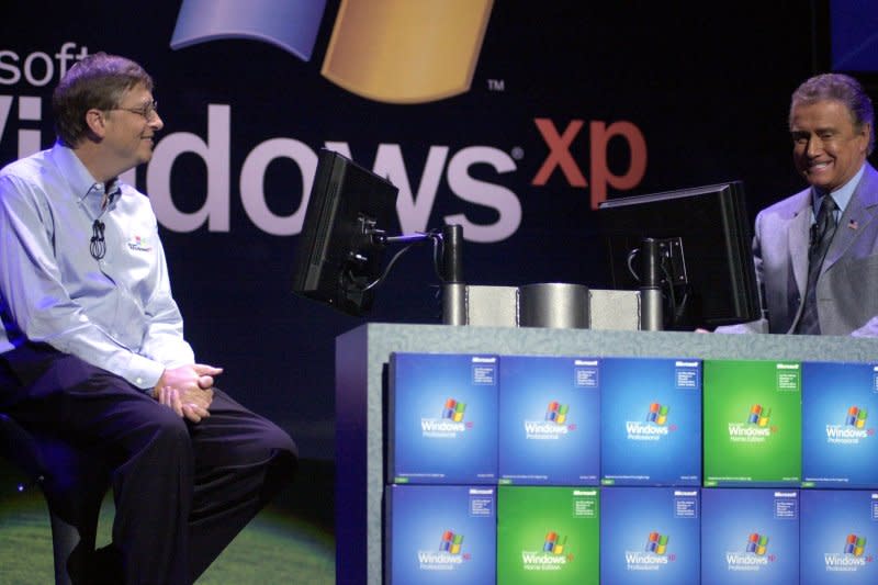 Microsoft CEO Bill Gates (L) plays a fake game of "Who Wants To Be a Millionaire" with Regis Philbin during the October 25, 2001, New York launch of Microsoft Windows XP. On November 10, 1983, Microsoft released its Windows computer operating system. File Photo by Ezio Petersen/UPI